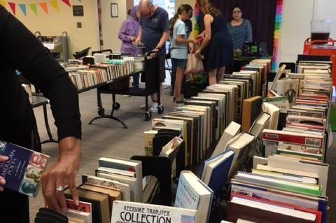 Library customers browse the 2018 Big Book Sale at Independence Regional