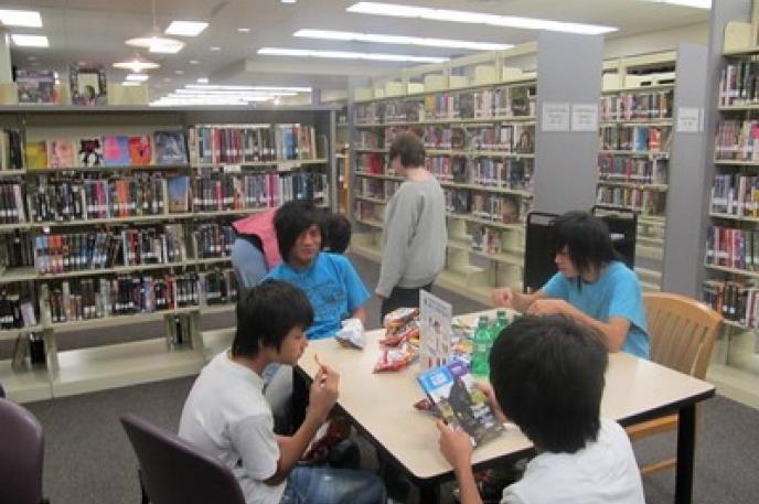 Asian American students participating in a Library event. Asian American students participating in a Library event.