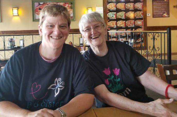 Sue Abbate smiles with her mother, Terry, after finding her parents through genealogical research support from the Charlotte Mecklenburg Library's Robinson-Spangler Carolina Room.