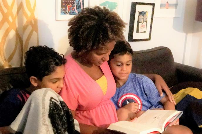 Ailen Arreaza, Charlotte Mecklenburg Library Board of Trustee member, reads to her two rambunctious sons who love libraries as much as she does! Ailen Arreaza reads to her two sons as Charlotte Mecklenburg Library cardholders and aficionados.