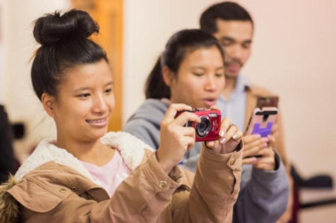 Participants learn camera techniques in Finding Home Again