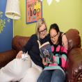 Reading buddies read together at Charlotte Mecklenburg Library.