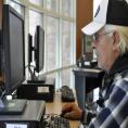 Man using computer at Charlotte Mecklenburg Library's Job Help Center.