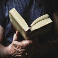 Librarian holding a book