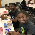 Children enjoy lunch at West Boulevard Library thanks to the Summer Food Service program, a partnership with Charlotte Mecklenburg Schools